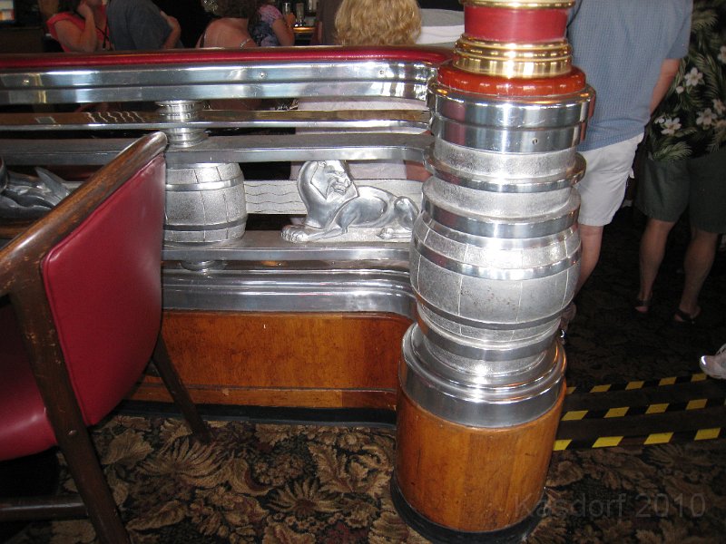 Queen Mary 2010 0380.JPG - The railing in the lounge... beer kegs!